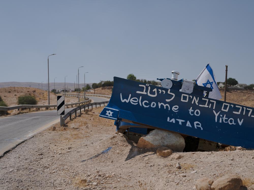 A painted bulldozer on the road to Yitav, an Israeli settlement in Al-Auja that overlooks the spring water where the Palestinian community gathers. 