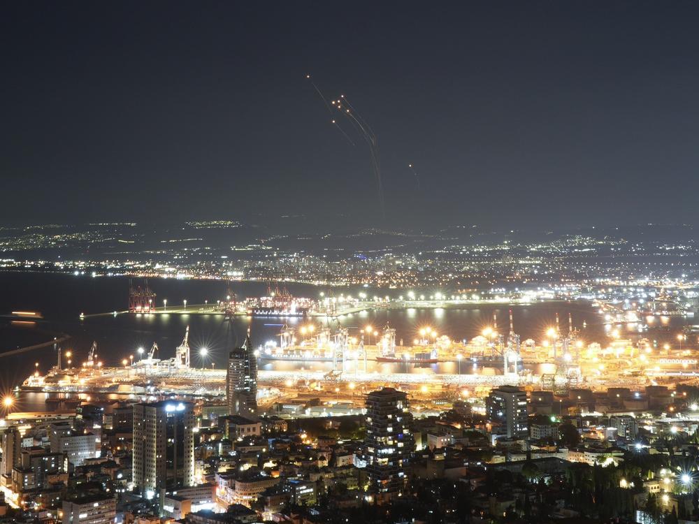 Israeli Iron Dome air defense system fires to intercept rockets that were launched from Lebanon, in northern Israel, on Tuesday.