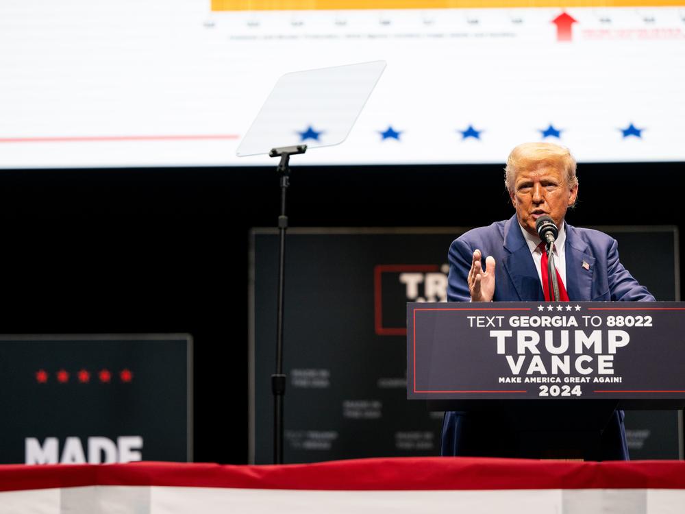 Former President Donald Trump speaks to attendees during a campaign rally at the Johnny Mercer Theatre in Savannah, Ga., on Tuesday. 