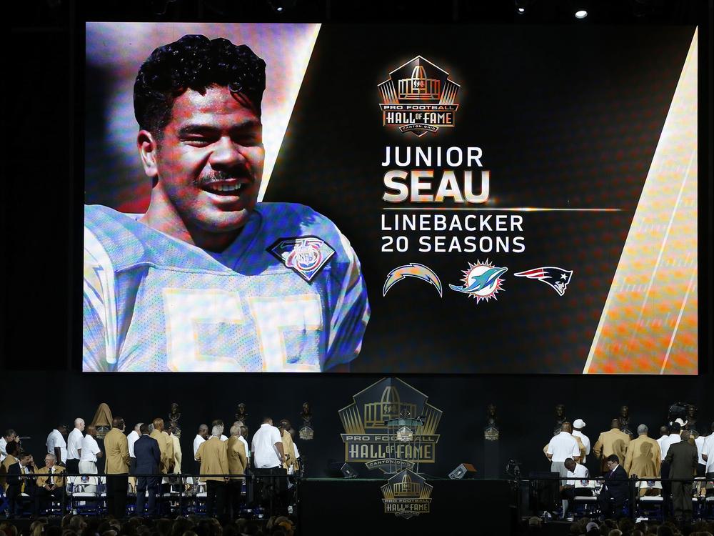 Junior Seau is honored posthumously on the video board during the NFL Hall of Fame induction ceremony on August 8, 2015, in Canton, Ohio. Seau shot himself in the chest in 2012 and a later analysis of his brain showed he had symptoms of CTE.