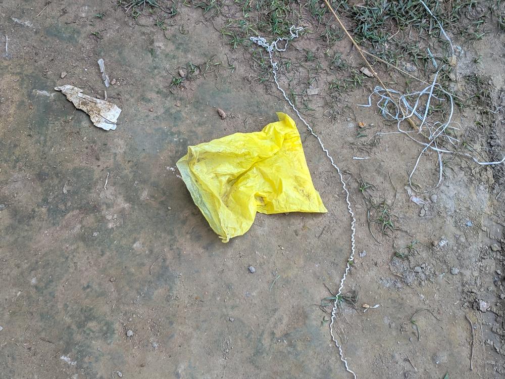 At a turmeric polishing mill in Bangladesh, a discarded plastic bag is tinted yellow, a telltale sign that it had been filled with the bright yellow pigment called lead chromate.
