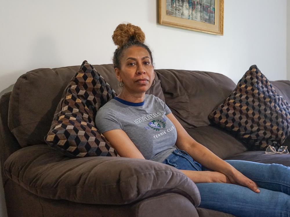 Debra Ragoonanan, a nursing assistant, says she has endured PTSD after COVID killed dozens in 2020 at the Massachusetts veterans facility where she still works. The state agreed to a $56 million settlement for veterans and their families, but caretakers have gotten little assistance. 