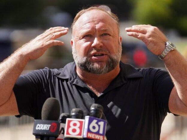 nfoWars founder Alex Jones speaks to the media outside Waterbury Superior Court during his trial on Sept. 21, 2022, in Waterbury, Conn.