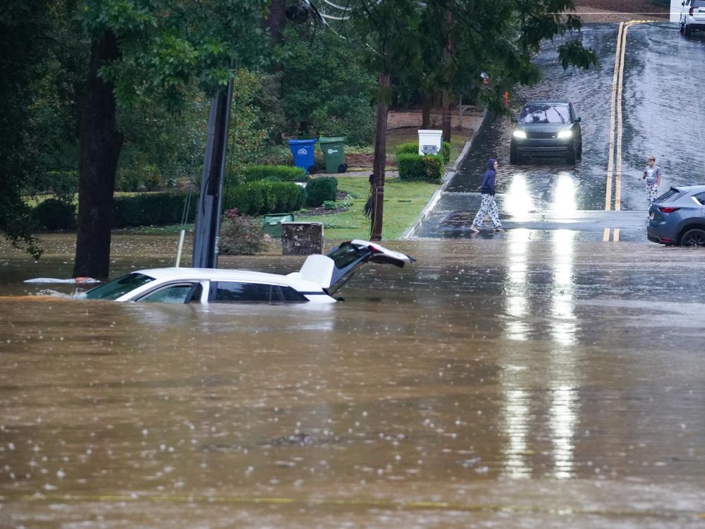 The streets are flooded near Peachtree Creek after hurricane Helene brought in heavy rains over night on September 27, 2024 in Atlanta, Georgia.