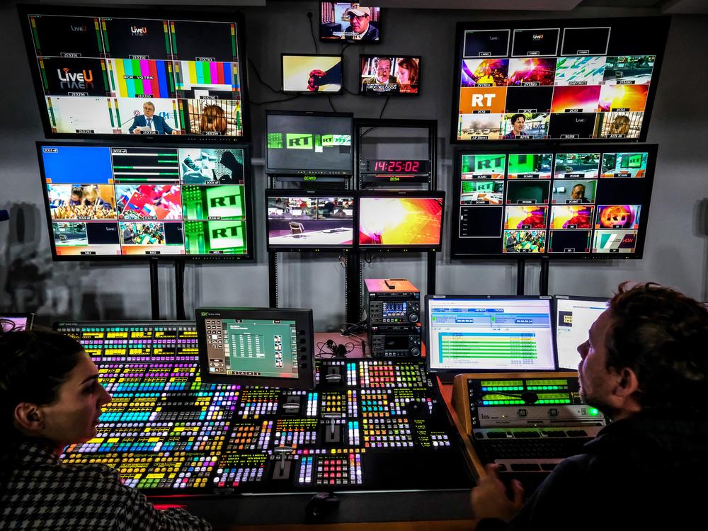A file photo from June 8, 2018 shows a control room at RT's Moscow studios. The state media organization has been accused by the Justice Department of covertly paying pro-Trump influencers in the U.S. 