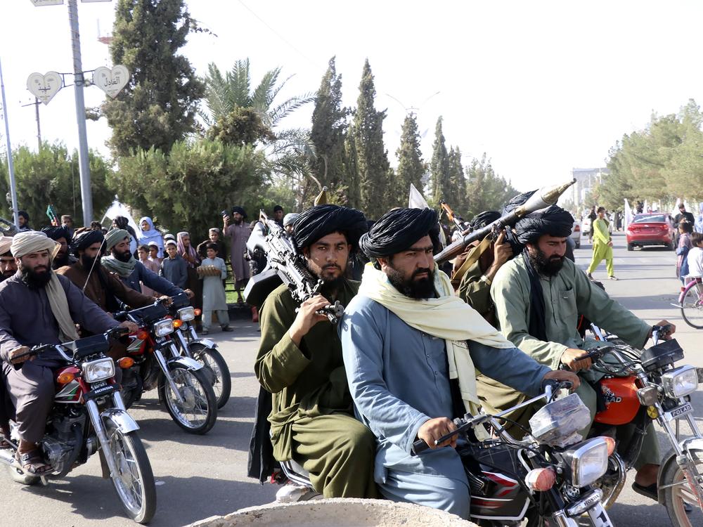 Taliban fighters celebrate the third anniversary of the withdrawal of US-led troops from Afghanistan on Aug. 14, 2024.