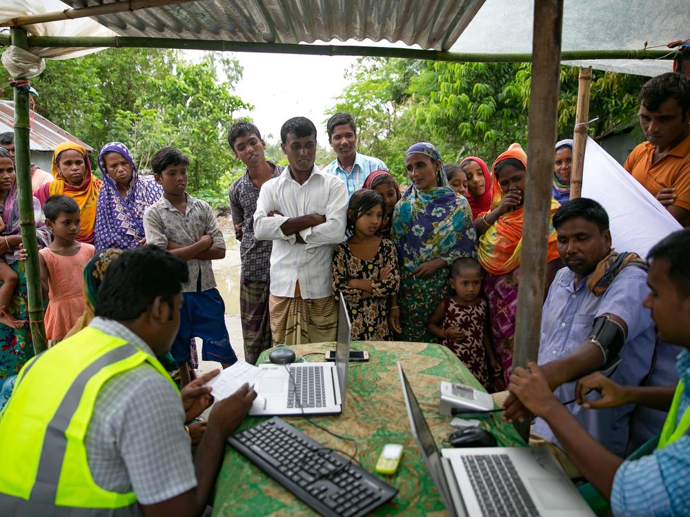 Patients line up for remote health consultation sessions near Rangpur, Bangladesh. The country has emerged as a model of health-care progress in the Global South.