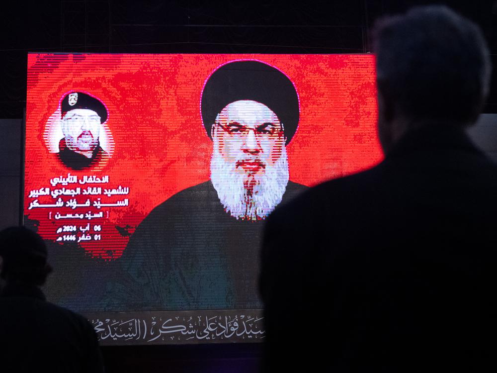 Supporters listen to Hezbollah leader Hassan Nasrallah via a video link during a ceremony to mark the first week since the killing of Hezbollah's top commander Fuad Shukr on August 6 in Beirut. The militant group on Saturday confirmed Nasrallah had been killed following Israeli airstrikes.