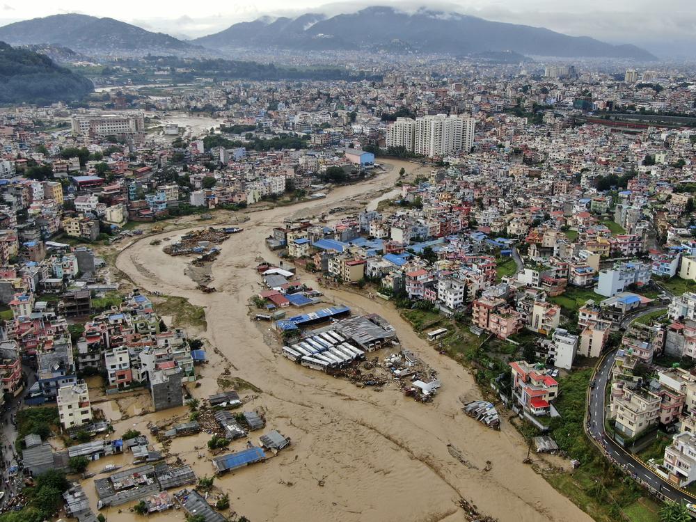 In this aerial image of the Kathmandu valley, Bagmati River is seen flooded due to heavy rains in Kathmandu, Nepal, Saturday, Sept. 28, 2024. 