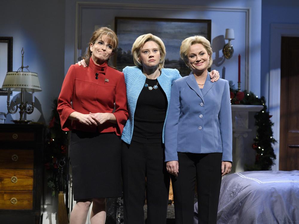 Tina Fey as Sarah Palin, Kate McKinnon as Hillary Clinton, and Amy Poehler as Hillary Clinton during the 
