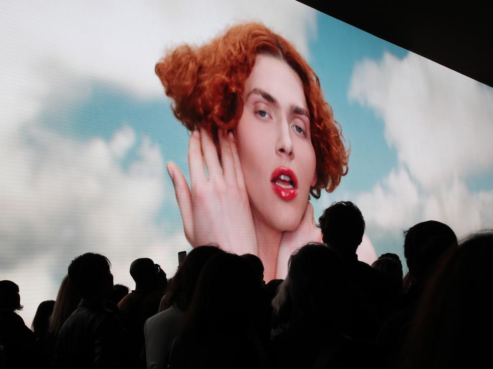 SOPHIE on the screen during the Louis Vuitton Womenswear Spring/Summer 2020 show.