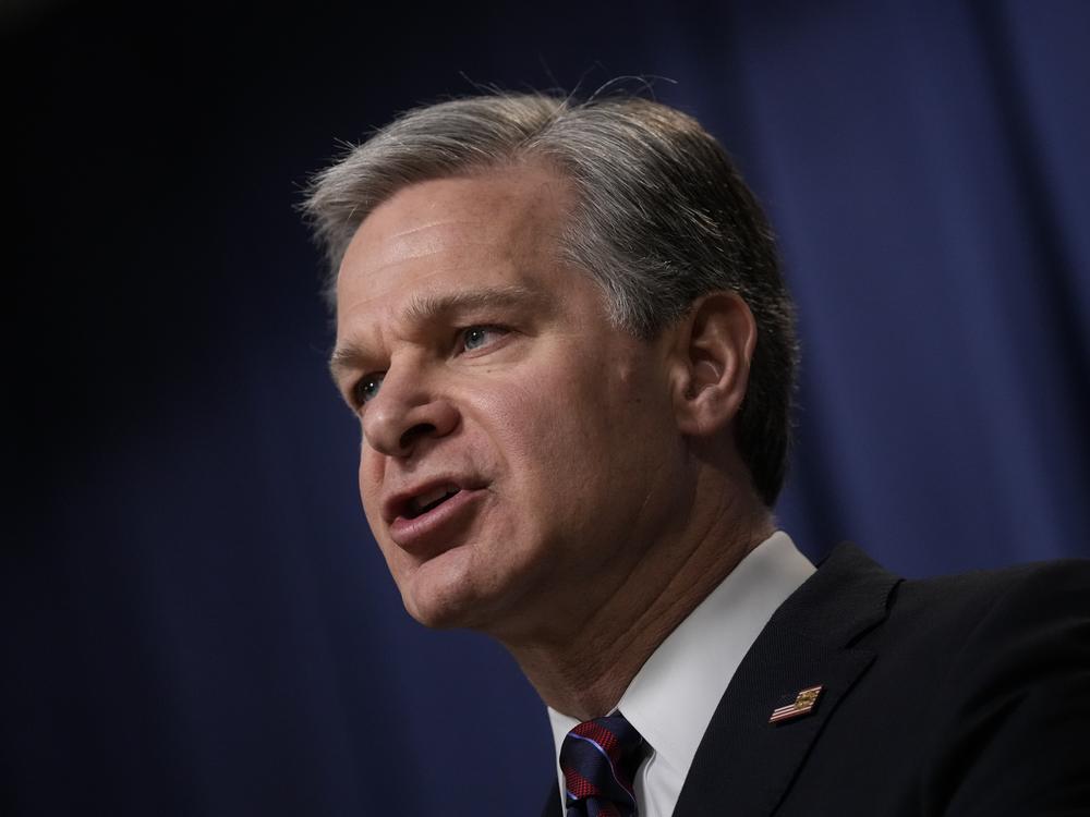 FBI Director Christopher Wray speaks during a news conference in 2023.