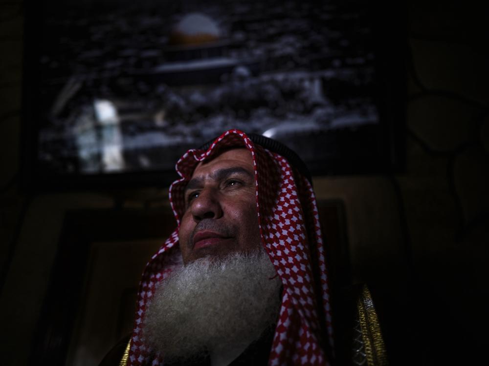 Sheikh Walid Tawil is representing the family of the defendant in a parallel Palestinian justice system of community reconciliation.
