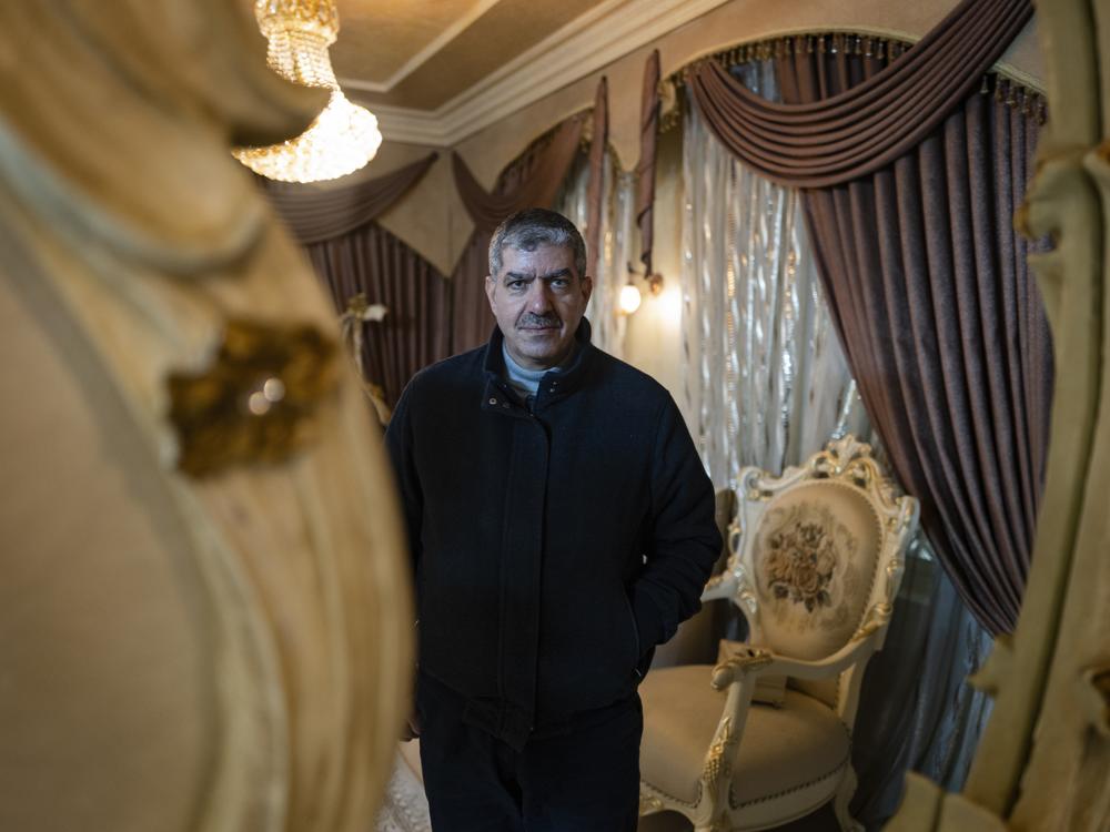 Mohammed Abu Eisheh, a dentist whose son Anas has been charged with the murder of Ahmad Abu Markhiya, poses for a photo in his home. After Israeli media reported that Abu Markhiya was gay, Abu Eisheh says, public opinion in Hebron 