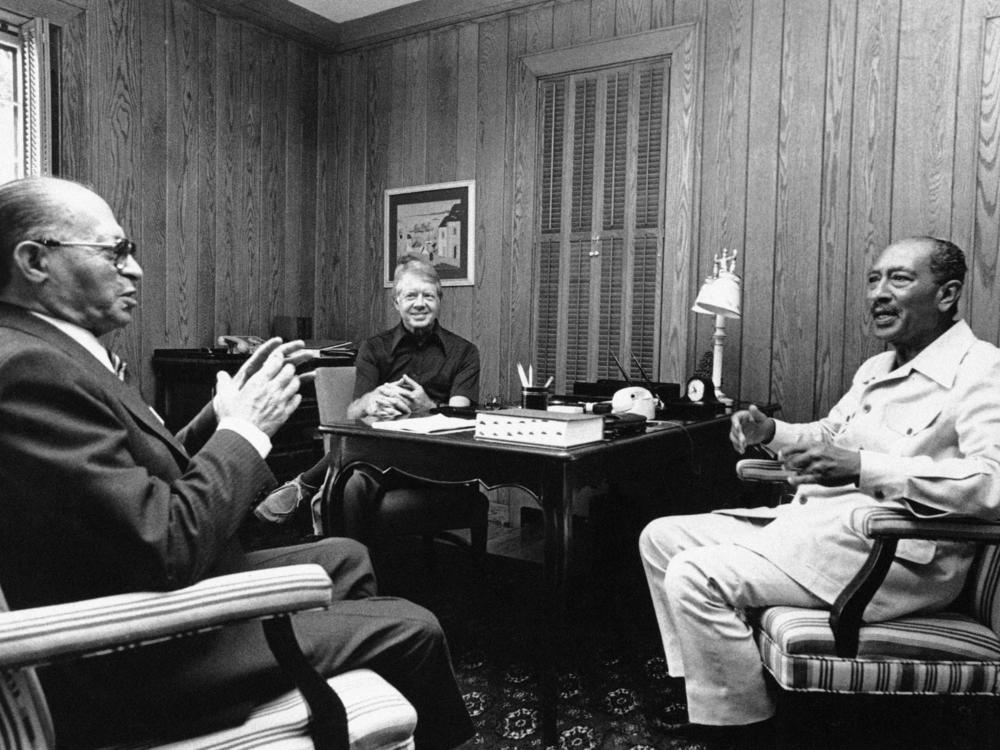 Israeli Prime Minister Menachem Begin (from left), Carter, and Egyptian President Anwar Sadat begin their second day of peace talks at Camp David, Md., in September 1978. The secret meetings at the presidential retreat resulted in the Camp David Accords, which established a framework for peace between Egypt and Israel.