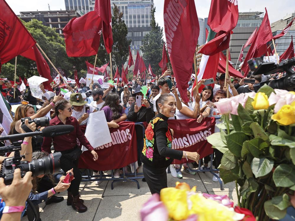 Claudia Sheinbaum greets supporters during a closing campaign rally for her presidential candidate bid to represent the ruling MORENA party, in Mexico City, Aug. 26, 2023.