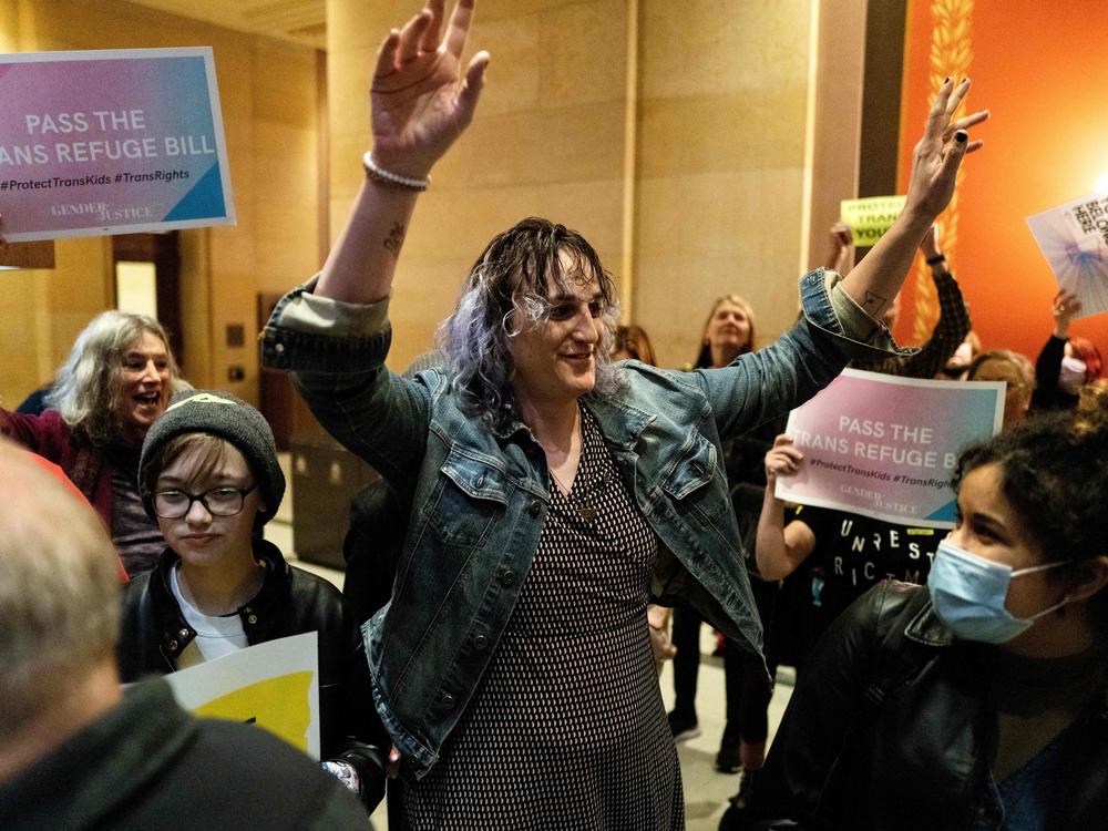 Rep. Leigh Finke, Minnesota's first openly trans legislator, arrives to cheers from supporters just before before the Minnesota Senate introduced the trans refuge bill at the state capitol building in Saint Paul in April 2023. Transgender rights may come up in the vice presidential debate on Tuesday.