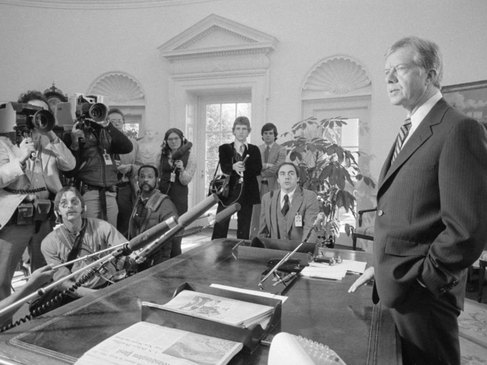 Carter speaks to reporters in the Oval Office in April 1980 about the Iran hostage crisis. Student militants stormed the U.S. Embassy in Tehran in November 1979 and held more than 50 staffers <a href=