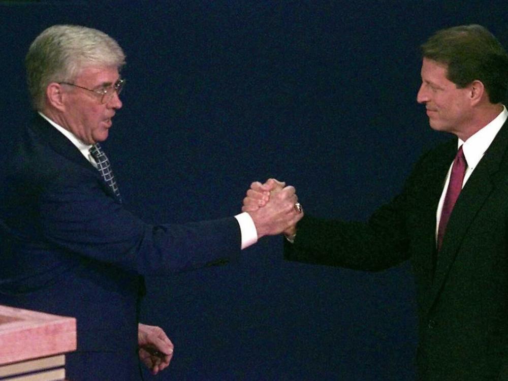 Republican vice presidential candidate Jack Kemp (left) shakes hands with Vice President Al Gore moments before the 1996 vice presidential debate in St Petersburg, Fla. It was the last time -- until this year -- that both major parties had picked a veteran for vice president.