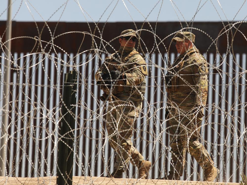 Members of the U.S. military patrol the banks of the Rio Grande as seen from Ciudad Juarez, Chihuahua state, Mexico on May 8, 2023.