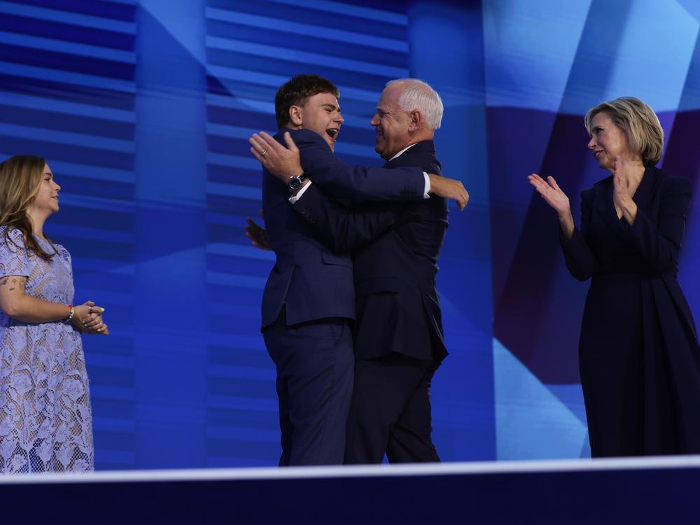 Tim Walz celebrates with his son Gus Walz at the Democratic National Convention.