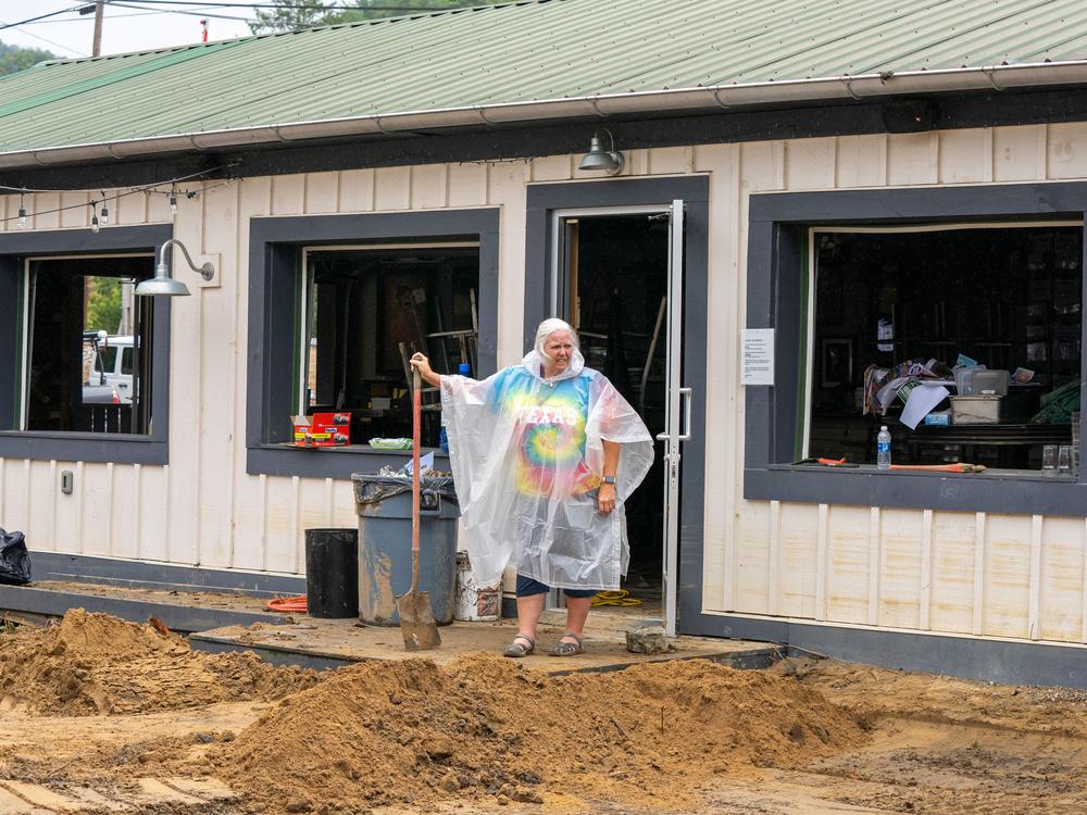 Sherry Ramsey shovels out a brewery in Hot Springs, N.C.