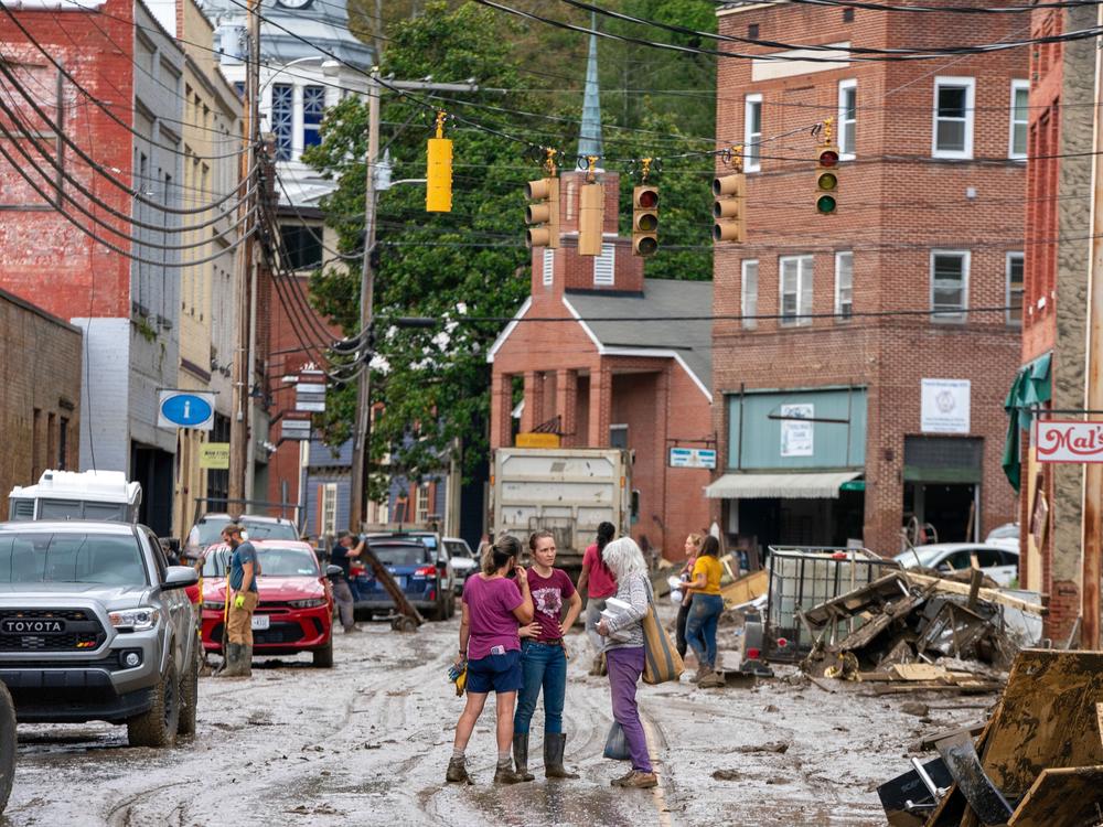 Main street in Marshall, N.C. After two days of community cleanup, the road is drivable, though still covered in slippery mud.