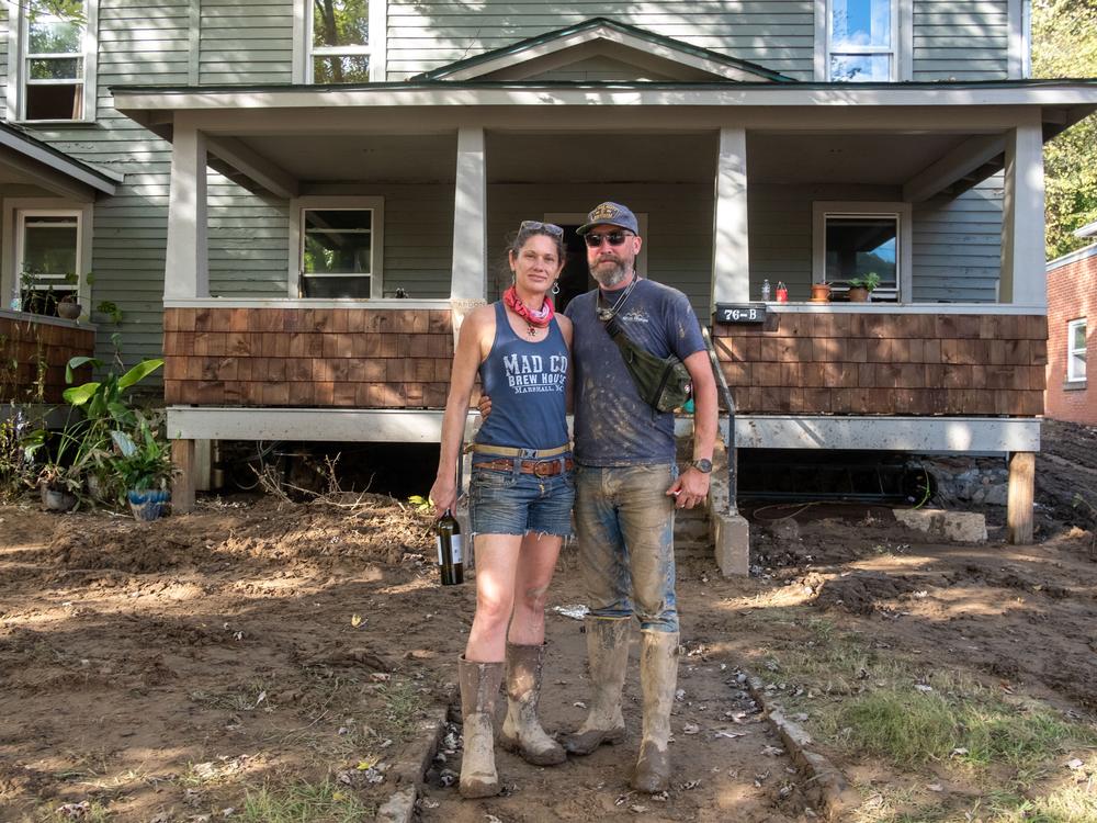Rhesa and Brandon Edwards spent the day salvaging what equipment they could from the mud in their brewery, Mad Co. Brew House in Marshall.