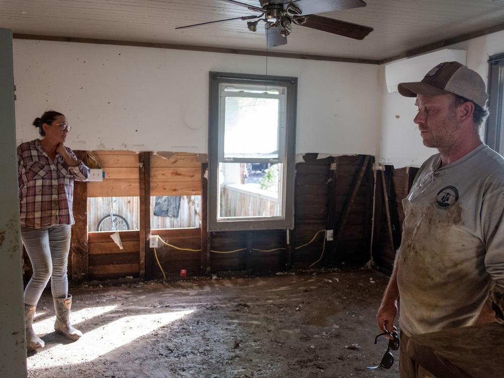 Concerns about mold pushed the Hoczs to spend long hours ripping out all the sodden drywall from the first floor of the house they  leased to renters before the flood.
