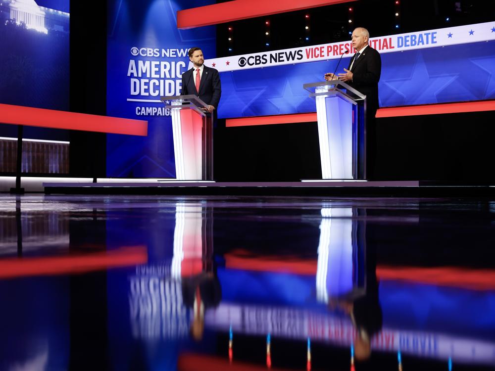 Republican vice presidential candidate Sen. JD Vance and Democratic vice presidential candidate Gov. Tim Walz participate in a debate at the CBS Broadcast Center on Tuesday in New York City.