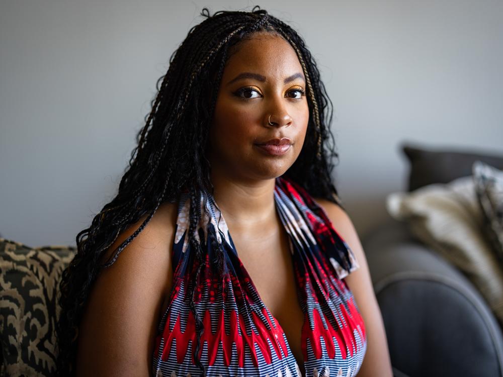 Chenedy Wiles, 27, poses for a portrait at her home on Wednesday in Chicago. Wiles took a 23andMe test over the summer and got her results in September. While she finds the data breach concerning, “so much of our data is already out there,” she said.