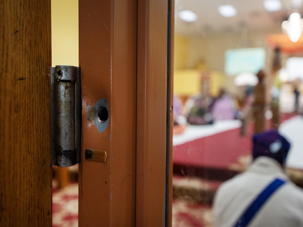 A bullet hole from the 2012 shooting can still be seen in a door frame.