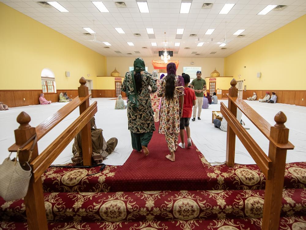 People walk into the prayer hall on a recent Sunday.