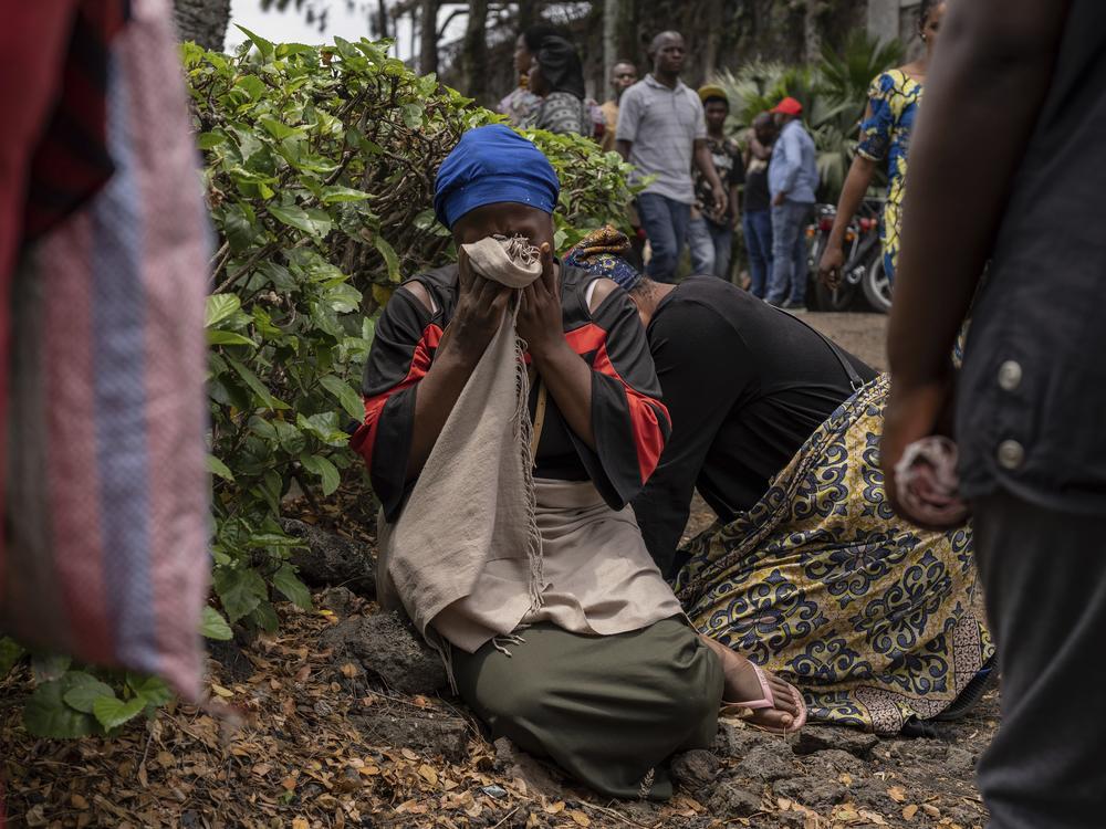 Women grieve at the port of Goma, Democratic Republic of Congo, after a ferry carrying hundreds capsized on arrival Thursday.