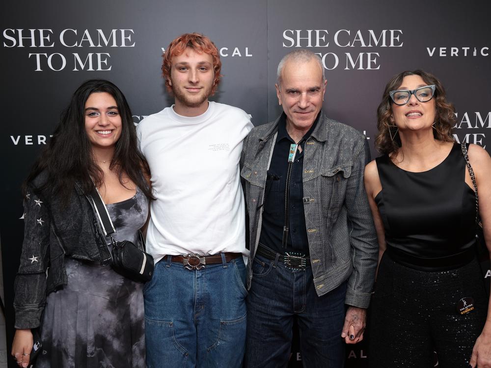 Ronan Day Lewis and his father, Daniel Day-Lewis (left to right in center) are teaming up for a feature film that will bring the decorated actor out of retirement. The pair are seen here as they attended a film screening last year.