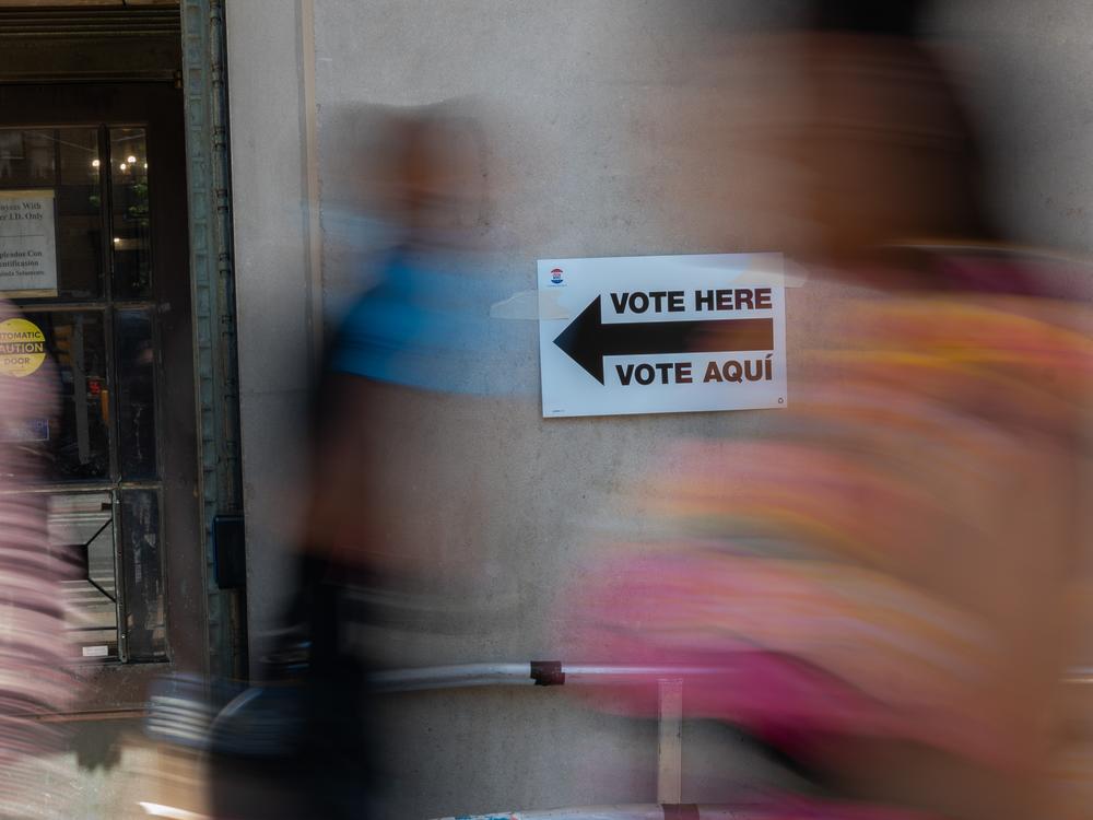 In this file photo, a sign directs people to a voting site in the Bronx during the Democratic primary on June 25 in New York.