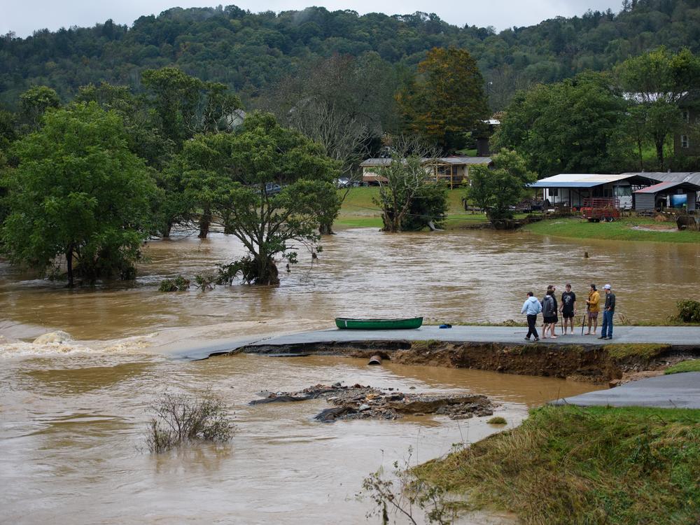 BOONE, NORTH CAROLINA - SEPTEMBER 27: A group of friends canoed the South Fork New River in Boone, North Carolina, looking at the destructions from Hurricane Helene. The death toll from the storm is already over 100 people, but the true number will likely be many times that, according to a new study.