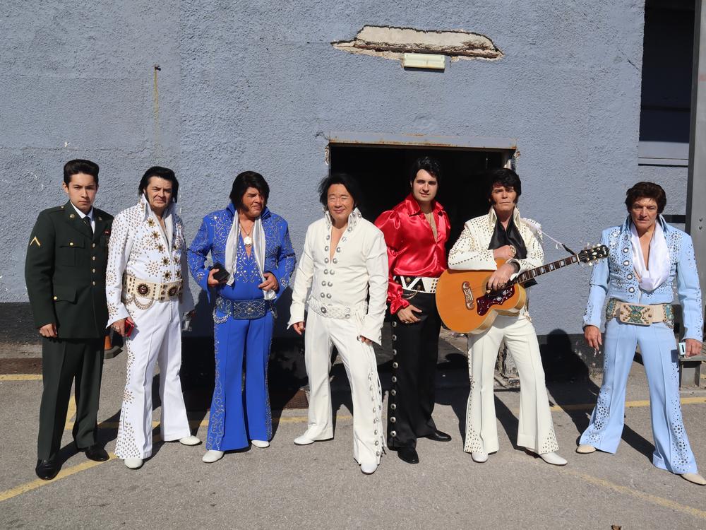 Elvis tribute acts at Porthcawl in Wales, including Blue Angel, wearing red
