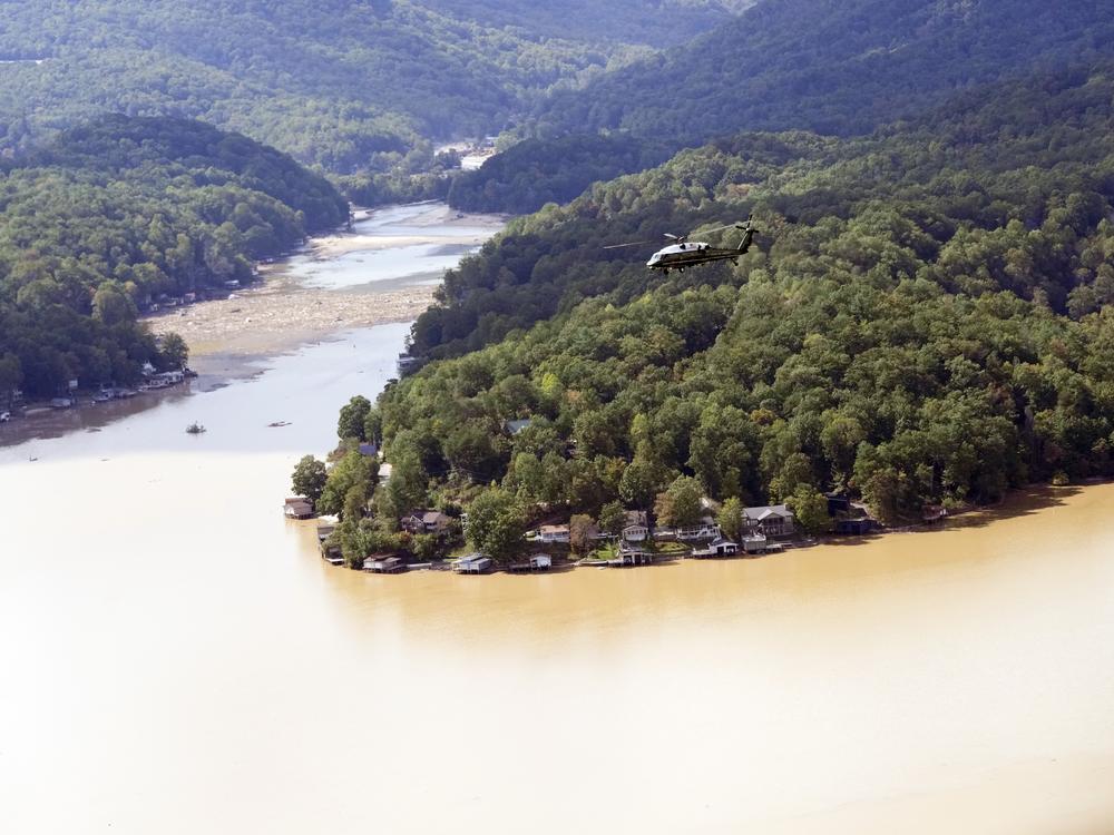 Marine One, with President Biden on board, flies over Lake Lure near Chimney Rock, N.C.,  southwest of the Baxter International plant closed by damage from Hurricane Helene.