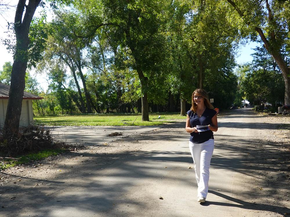 Republican Senate candidate Kathleen Fowke knocks on doors in a key district near Lake Minnetonka ahead of the election in Minnesota.