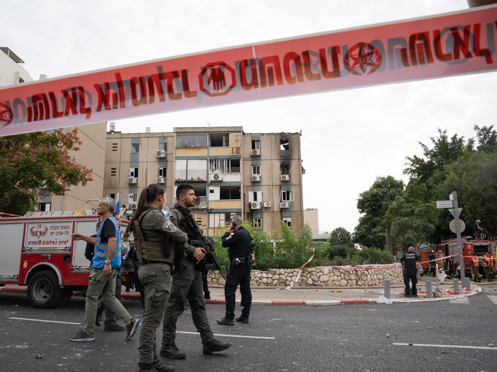 First responders at the site of a rocket strike that hit a residential building in Tel Aviv, Israel, on Oct. 27, 2023.