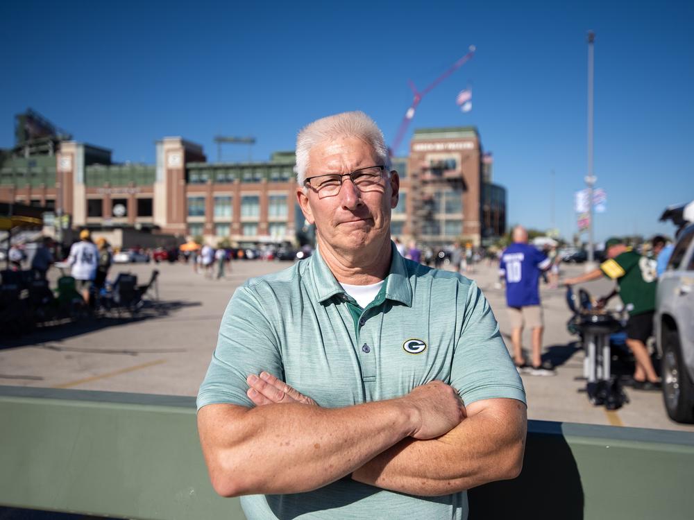 Wisconsin Assembly candidate Patrick Buckley stands outside Lambeau Field as fans tailgate Sunday, Sept. 29.