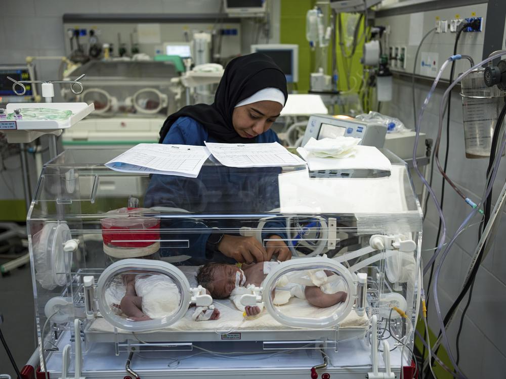 A nurse cares for babies born prematurely at the Emirati Hospital in Rafah, Gaza Strip, on March 8. Doctors there report numerous babies have died of malnutrition-related causes.