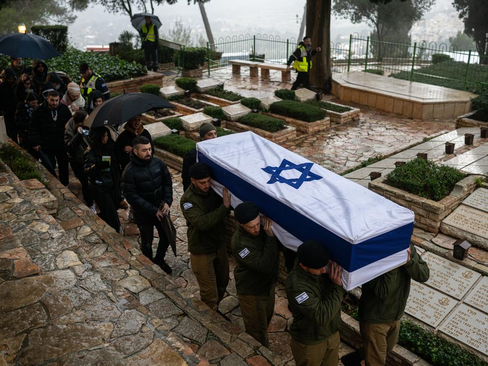 Israeli soldiers carry the casket of reservist Elkana Yehuda Sfez, who was killed in combat in Gaza, during his funeral at the Mount Herzl military cemetery in Jerusalem, on Jan. 23.