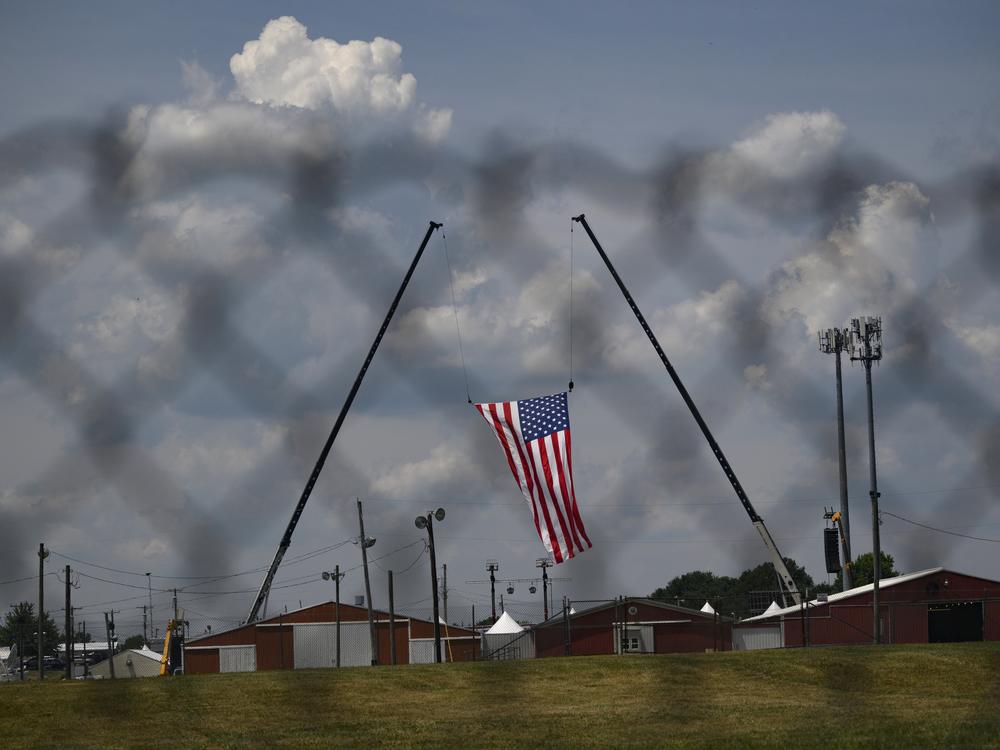 The American flag, that served as the backdrop for a campaign rally by former President Trump, blows in the wind at Butler Fairgrounds in the aftermath of the attempted assassination in July.