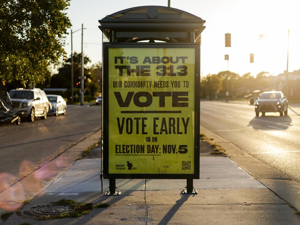 A sign encouraging people to vote on a bus stop on Oct. 5, 2024 in Detroit, Mich.