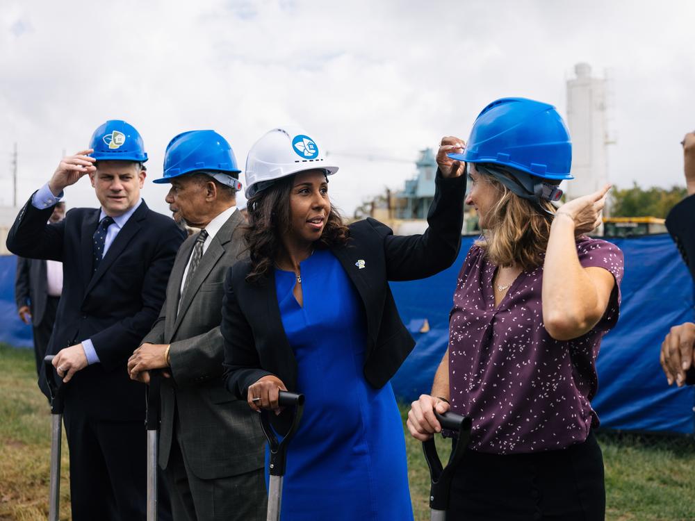Chelsea Andrews (white hat), president and executive director of Montgomery County's<strong> </strong>Housing Opportunities Commission, adjusts Maryland State Delegate Lorig Charkoudian's hardhat during a groundbreaking ceremony for the Hillandale Gateway housing development in Silver Spring, Md. The HOC says it owns more than 9,400 apartment, townhome and single-family home rental properties and provides subsidized housing for more than 9,300 households.