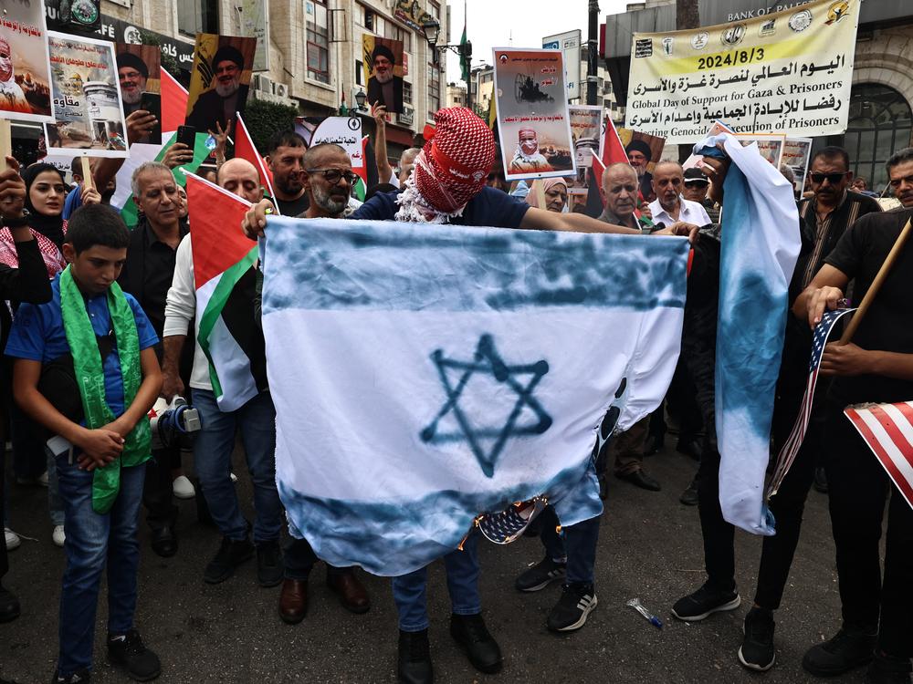 Palestinian protesters attend a rally to mark the first anniversary of Palestinian militant group Hamas' Oct. 7, 2023, attack on Israel, in Ramallah in the occupied West Bank on Monday.