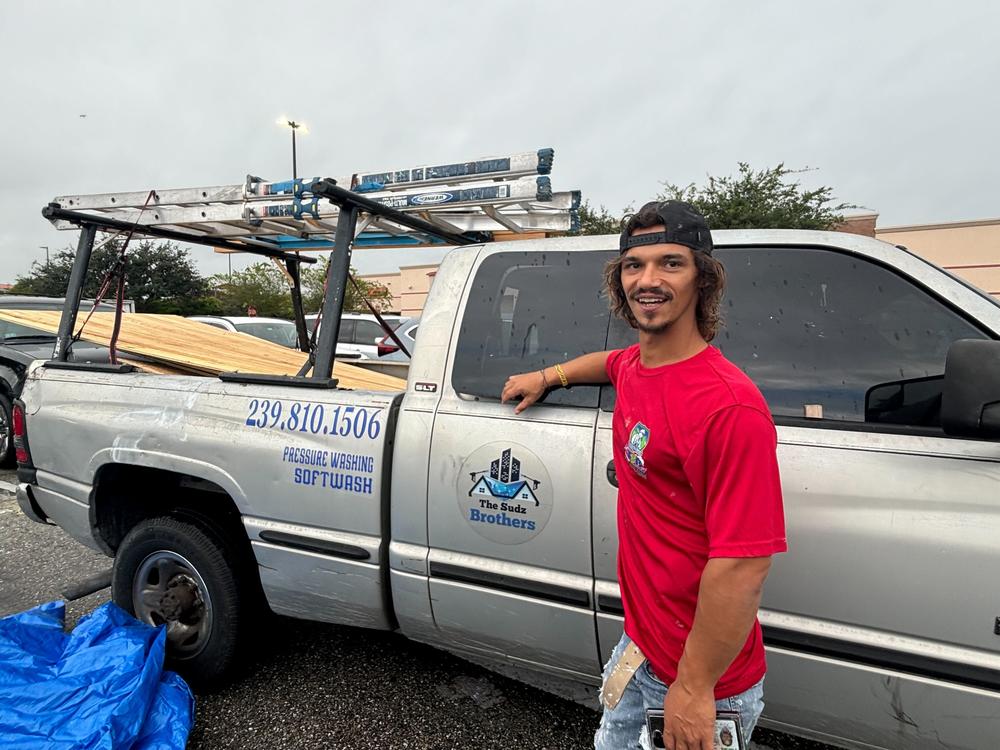 Robert Parker, 37, bought nearly a dozen plywood panels on Tuesday to put in his Fort Myers, Fla., home in preparation of Hurricane Milton.