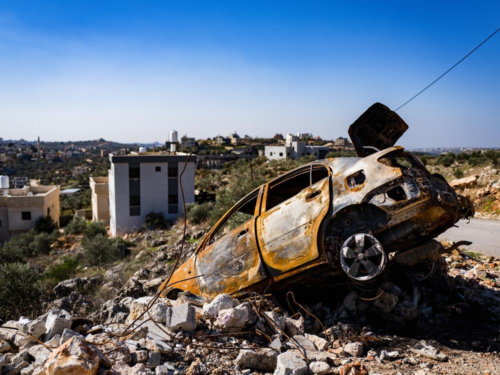 A car that was burned, destroyed and vandalized by armed Israeli settlers on Dec. 2, according to Palestinian residents in Qarawat Bani Hassan.